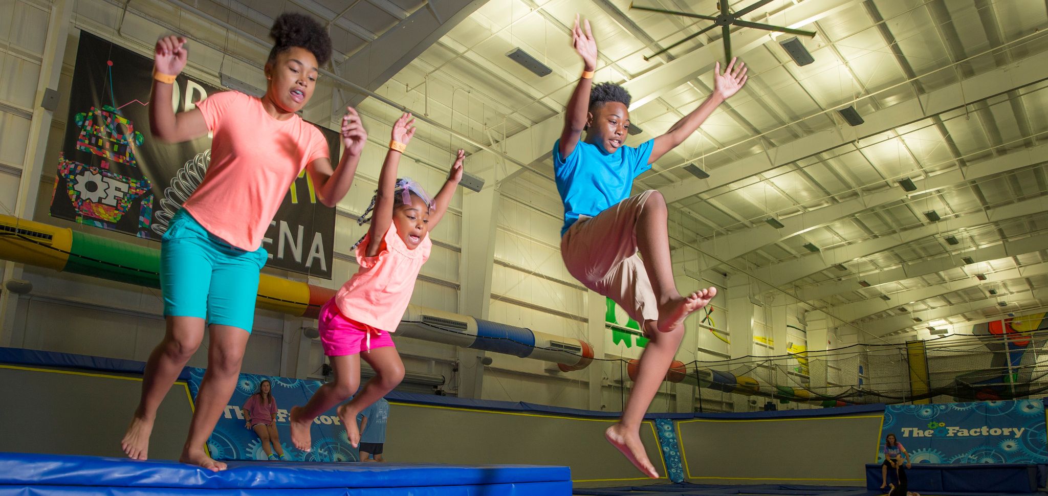 Kids jumping on a trampoline at The Factory Trampoline Park in Gulf Shores