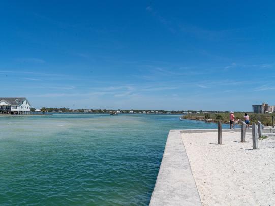 Calm waters of Little Lagoon Pass Park, fishing and birding spot in Gulf Shores