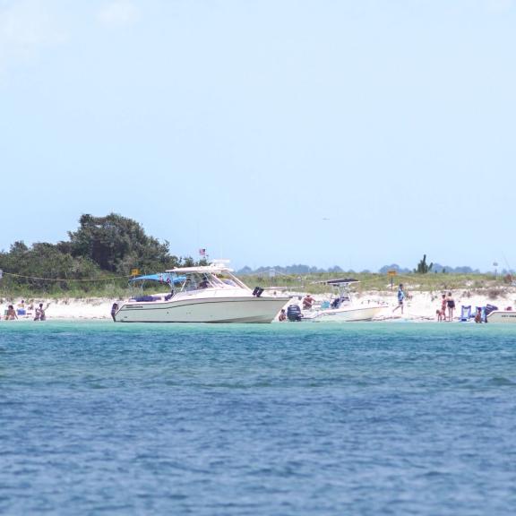 Boats anchored at Bird Island in Orange Beach