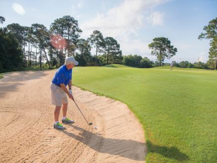 Man golfing in Gulf Shores