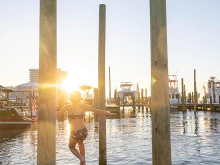Sunset at Flora-Bama Yacht Club in Alabama Beaches, highlighting a popular waterfront dining and entertainment spot.