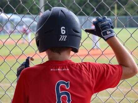 Boy watching Baseball