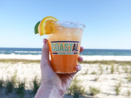 Orange Beach margarita in front of the beach at Coastal restaurant