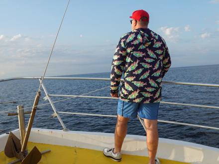 Man standing on an offshore fishing charter in Orange Beach