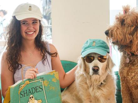 Girl and dog at Shades, dog-friendly store in Orange Beach