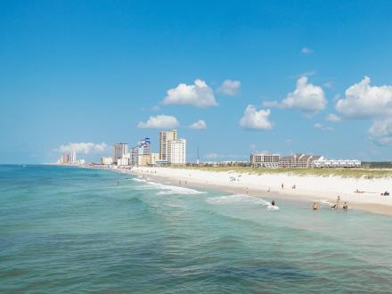 People in the water at the beach in Gulf Shores