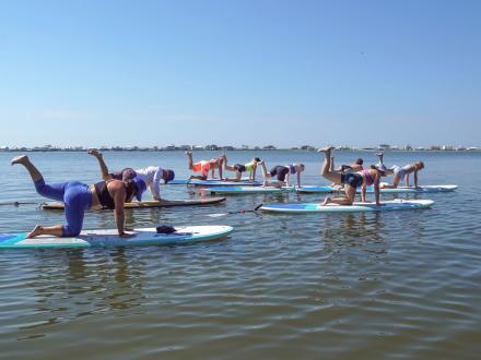 Yoga paddleboarding in Gulf Shores with Pure Aloha Adventures