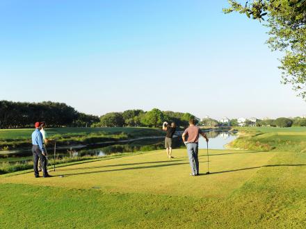 Men playing golf at Kiva Dunes Golf Resort in Fort Morgan.