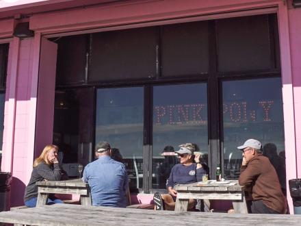 People dining on the deck at Pink Pony in Gulf Shores