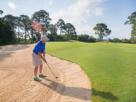 Golfer playing at Peninsula Golf & Racquet Club in Fort Morgan
