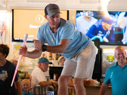 Man dancing on the table at The Hangout restaurant in Gulf Shores