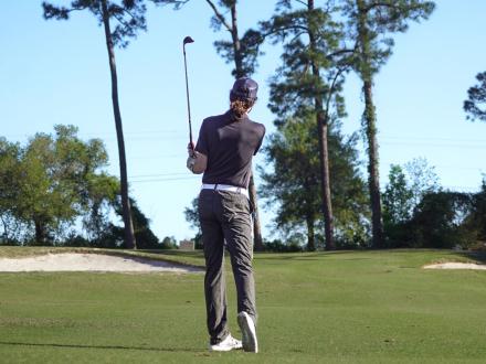 Golfer playing at One Club Golf Course in Gulf Shores