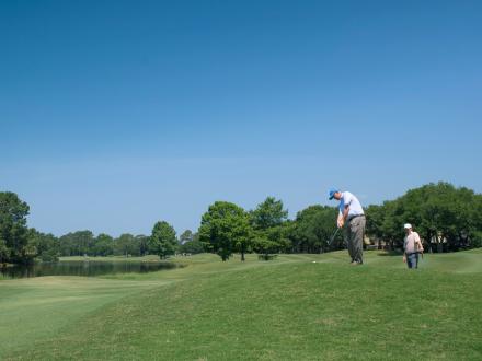 Golfers playing at Craft Farms Golf Club in Gulf Shores