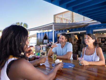 Friends having cocktails at The Gulf waterfront restaurant