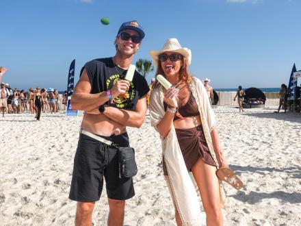 Couple with popsicles enjoying Sand in My Boots Festival